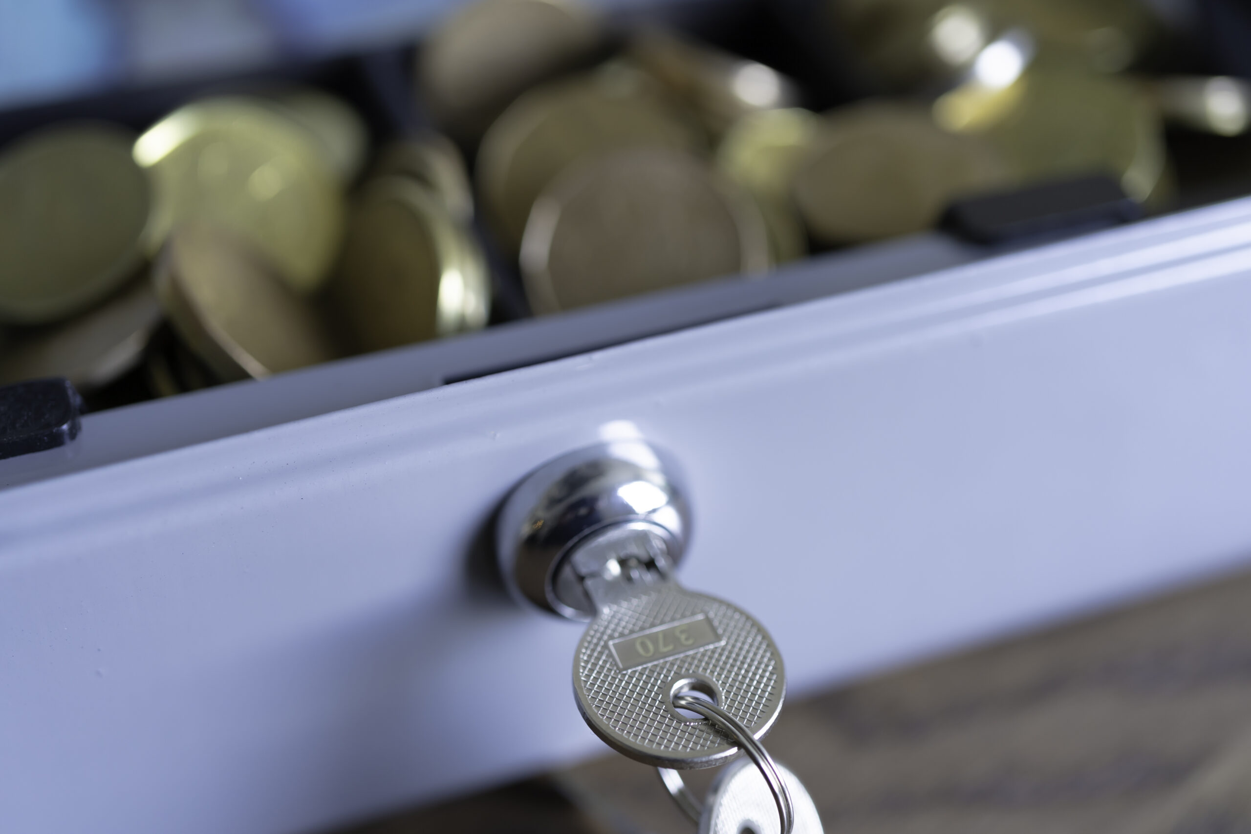 Cashbox lock with keys and full of Coins for petty cash